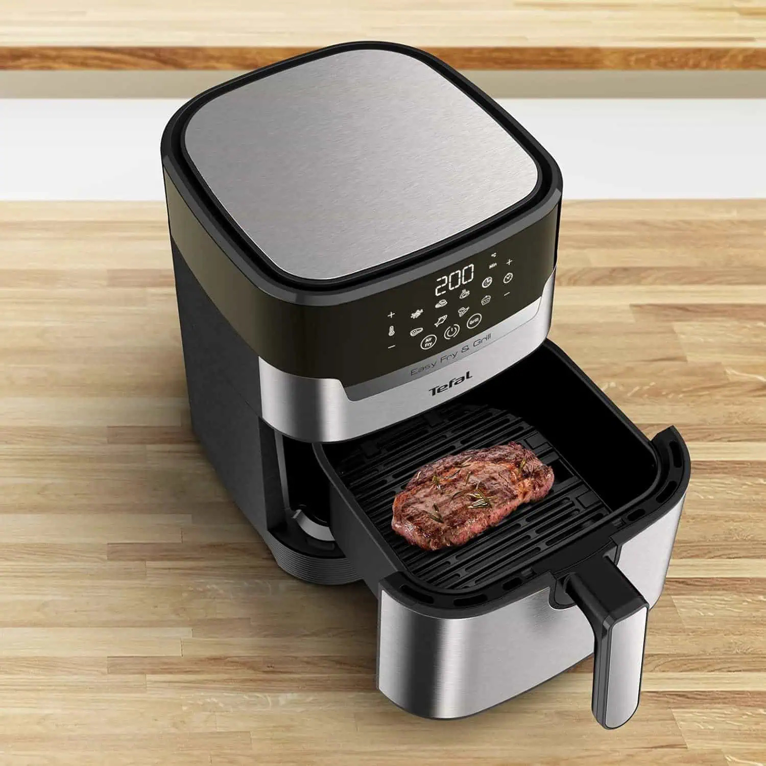 پخت استیک روی صفحه گریل سرخکن تفال مدل Easy Fry & Grill EY505 با کنترل دمای ۲۰۰ درجه
